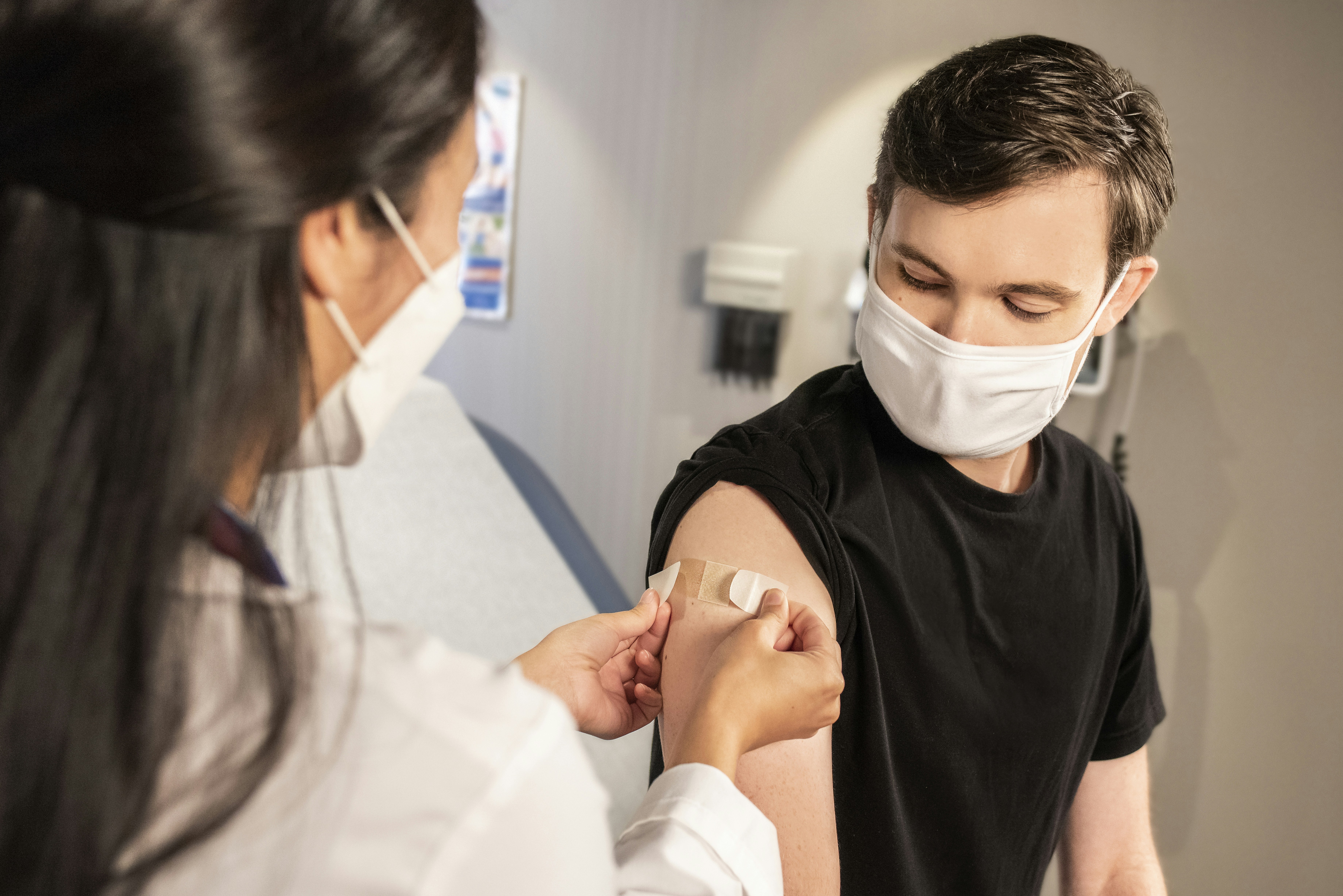 image of doctor administering bandage on patient