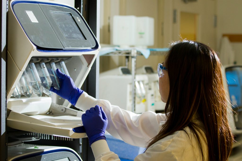 image of person performing tests with science equipment